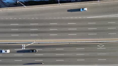Static-overhead-aerial-of-highway-traffic-on-sunny-day-in-Argentina