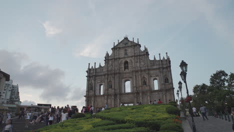 Macau---Ruins-of-St-Paul-Church-with-tourists-on-a-bright-summer-evening
