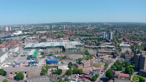 Dolly-forward-drone-shot-over-industrial-South-East-London-on-a-sunny-day
