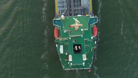 Aerial-establishing-shot-of-large-tanker-boat-in-water