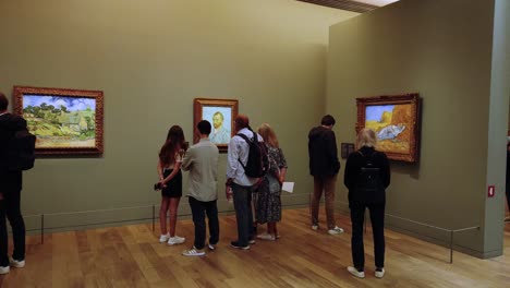 Van-Gogh-various-paintings-inside-a-gallery-in-the-Orsay-museum-with-visitors