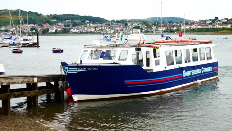 Sightseeing-cruise-boat-departing-Welsh-mountain-marina-tourism-staycation
