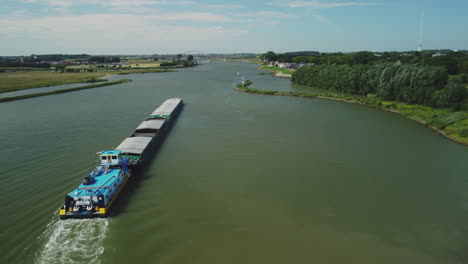 Close-aerial-view-of-inland-vessel-Alina-Lemmer-on-Dutch-river-de-Lek