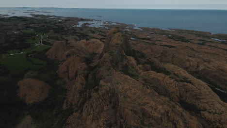 Scenic-View-Of-Rock-Formations-And-Sea-in-Leka-Island---aerial-shot