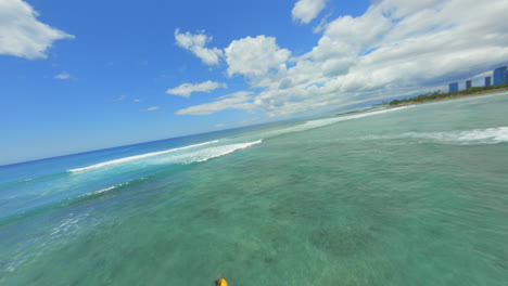 Adventure-Awaiting,-Drone-Shot-Over-Turquoise-Blue-Waters-of-Waikiki-Beach-in-Oahu,-Hawaii,-Surfers-and-Paddleboarders-Enjoying-the-Outdoors