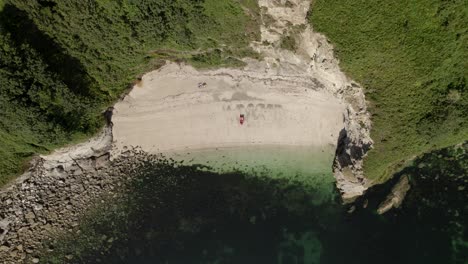 Sandy-Beach-Cove-Cornwall-South-Coast-Aerial-Overhead,-Birds-Eye-View