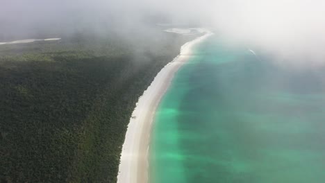Secluded-tourist-beach-at-dawn:-Aerial-view-with-high-morning-fog