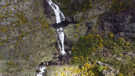 Sweeping-aerial-drone-view-of-the-beautiful-Cascata-De-Fisgas-Do-Ermelo---Cascading-waterfalls-in-the-Parque-Natural-do-Alvao---Portugal
