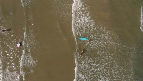 Birds-eye-view-of-surfers-in-the-Gulf-of-Mexico-off-the-coast-of-Lake-Jackson-in-Texas