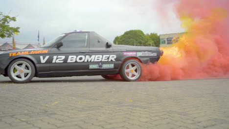 V12-Bomber-Car-Leaving-Fiery-Trail-With-Red-Smoke-During-Team-Lagrin-Stunt-Show-In-Germany