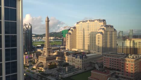 Early-morning-time-lapse-of-sunrise-on-Parisian-Hotel,-Macau
