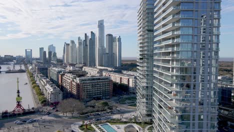 4K-Aerial-Drone-Footage-of-Apartments-and-City-View-of-Puerto-Madero-with-Blue-Skies-in-Buenos-Aires,-Argentina