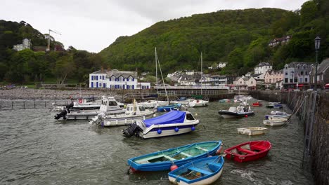 Small-fishing-boats-bob-up-and-down-on-the-waves-in-Lynmouth-Harbour-on-a-very-windy-day