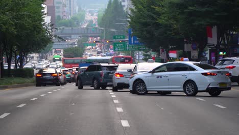 Cars-and-Taxies-Changing-Lanes-In-A-Traffic-Jam-To-Gangnam-Station-At-Gangnam-District,-South-Korea