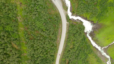 Aerial-View-Of-Vehicles-Driving-On-Road-At-Forest-Valley-To-Stryn-In-Norway
