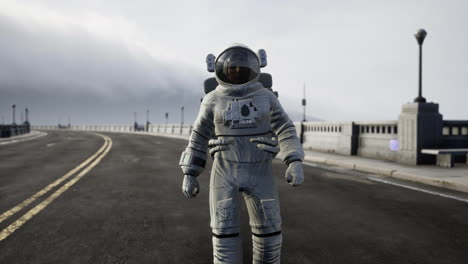 astronaut-in-space-suit-on-the-road-bridge