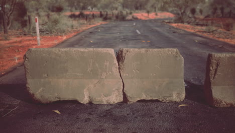 old-rusted-concrete-road-barrier-blocks