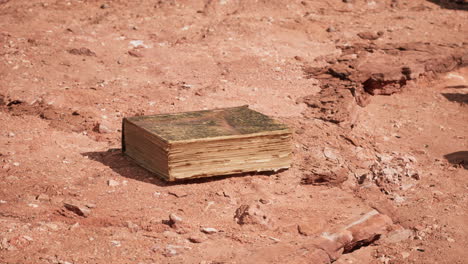 old-book-in-red-rock-desert