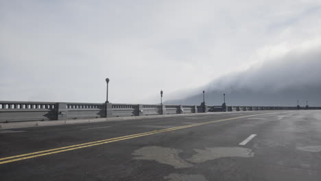 Old-empty-stone-bridge-on-a-foggy-day