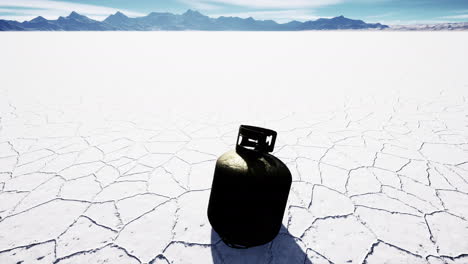 old-rusted-danger-gas-container-on-salt-lake