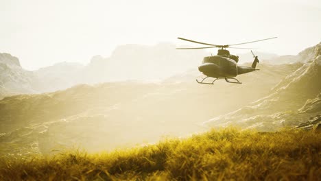 slow-motion-Vietnam-War-era-helicopter-in-mountains