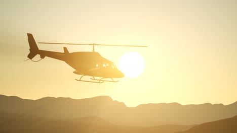 extreme-slow-motion-flying-helicopter-and-sunset-sky