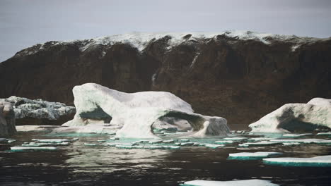 Blue-icebergs-of-Antarctica-with-frozen-and-snow-covered-Antarctic-scenery