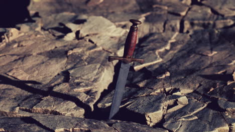 Excalibur-sword-in-rocky-stone-at-sunset