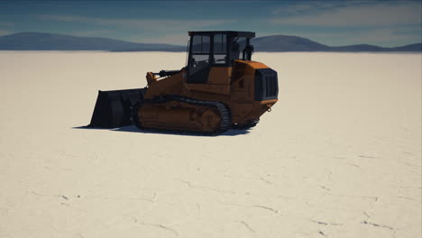 road-grading-machine-on-the-salt-desert-road