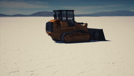 road-grading-machine-on-the-salt-desert-road