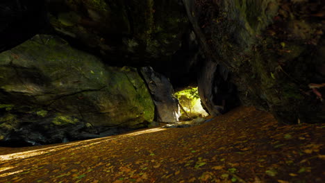 Shaft-of-light-beaming-down-into-large-cave