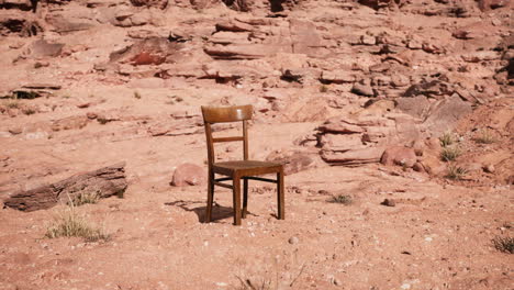 old-wooden-chair-on-rocks-of-Grand-Canyon