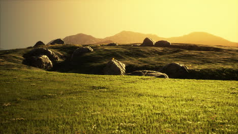 isolated-stone-on-meadow-in-mountains