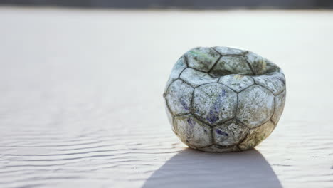 Vintage-Soccer-ball-on-sand