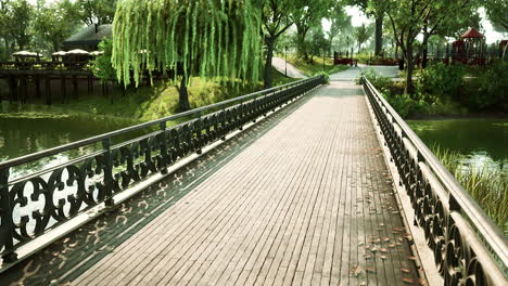 old-metal-bridge-over-a-small-river-in-park