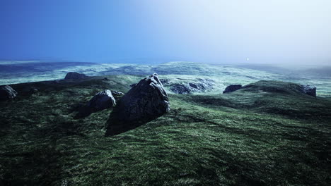 big-sand-stone-and-green-grass-hill-background