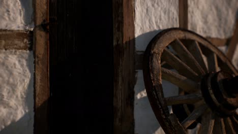 old-wood-wheel-and-black-door-at-white-house
