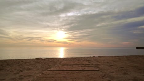 Sunset-beach.-Pov-walking-on-sea-beach.-Pov-shot-of-sea-sunset-at-sand-beach