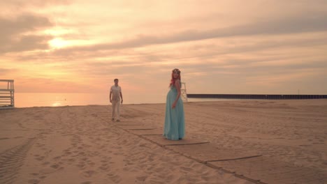 Love-couple-walking-towards-each-other.-Romantic-evening-on-beach