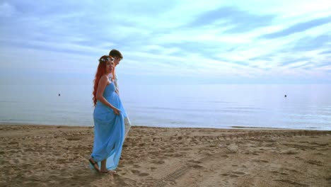 Couple-walking-on-beach.-Love-couple-walking-beach.-Happy-couple-beach