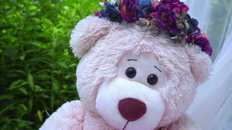 Bear-teddy-on-white-fabric-at-park.-Closeup-of-teddy-bear-on-grass