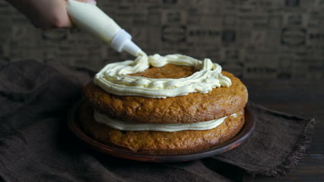 Baking-cake.-Closeup-of-cake-decoration.-Chef-decorating-cake-with-cream