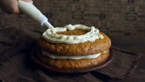 Baking-dessert-dish.-Chef-pouring-cream-on-carrot-cake.-Making-carrot-pie