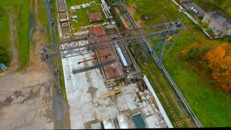 Aerial-view-working-industrial-crane.-Industrial-crane-loads-cargo