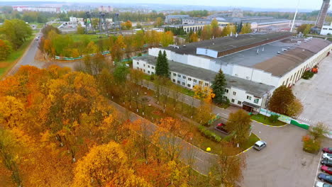 Aerial-view-of-industrial-building-at-autumn-landscape.-Modern-factory-building