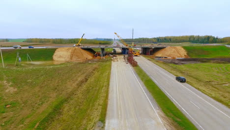 Aerial-view-construction-bridge-over-highway-road.-Repair-suburban-road