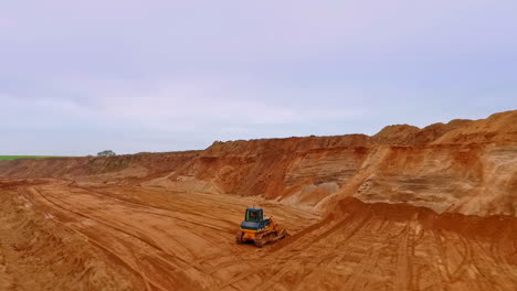 Buldozer-working-in-sand-quarry.-Earth-mover-in-sand-quarry.-Mining-equipment