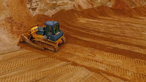 Crawler-bulldozer-work-in-sand-quarry.-Mining-machinery.-Construction-industry