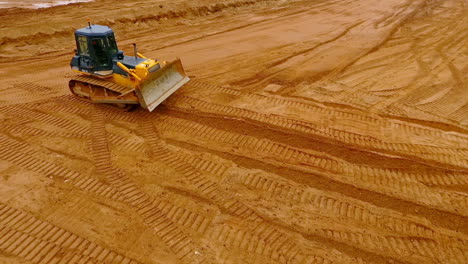 Sand-mining-industry.-Bulldozer-machine.-Crawler-bulldozer-moving-at-sand-mine