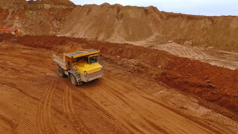 Sand-truck-moving-at-sand-mine.-Mining-industry.-Sand-quarry